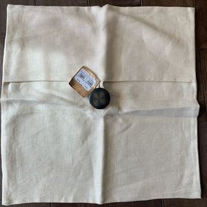 Pottery barn off white linen pillow with button.